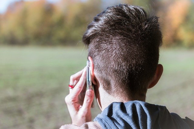 person holding phone to ear